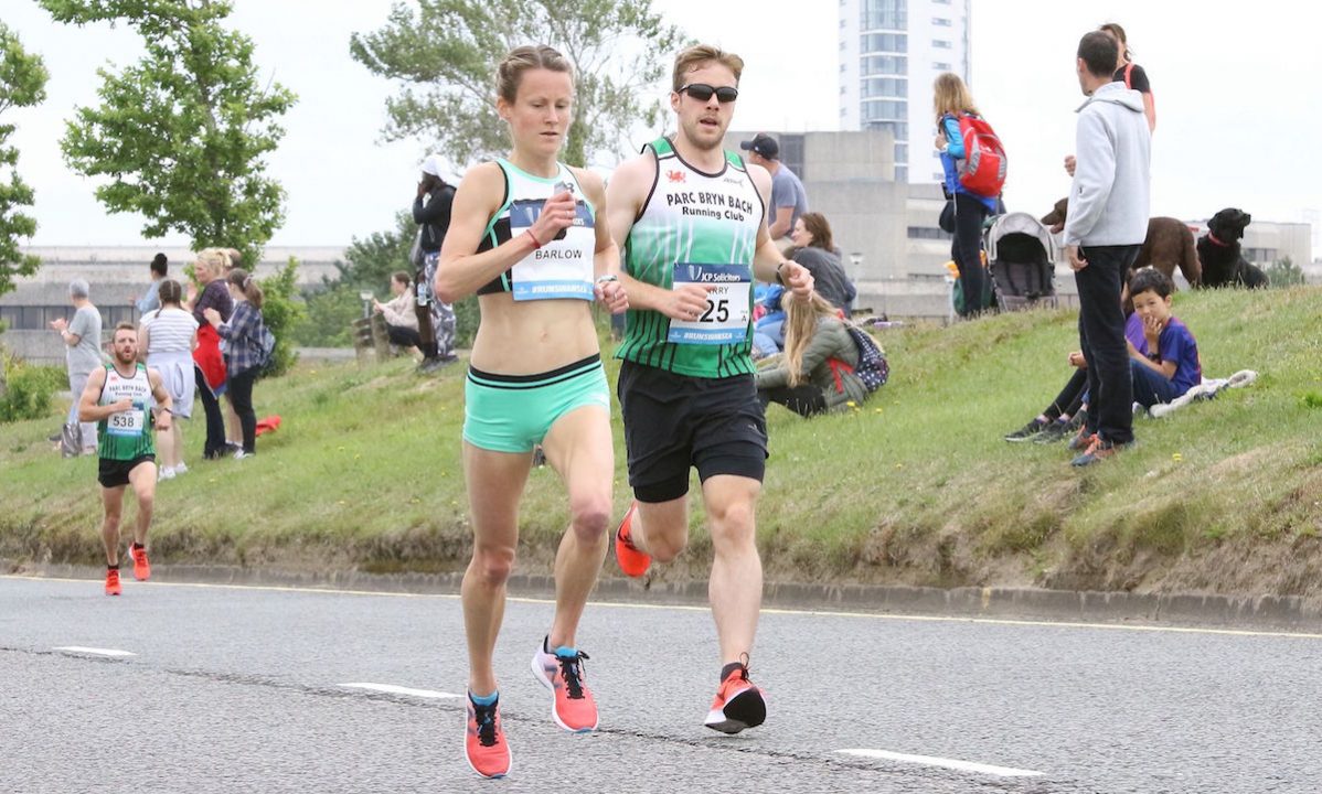 Tracy Barlow passes Swansea’s iconic Meridian Tower on her way to victory at the city’s half marathon. copy